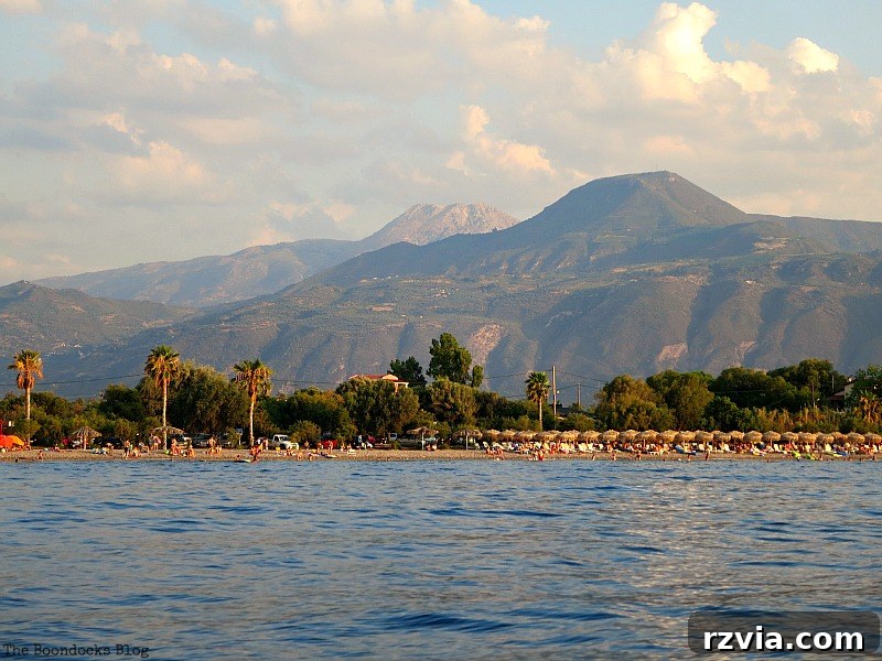 The stunning coast with palm trees and inviting beaches from the boat