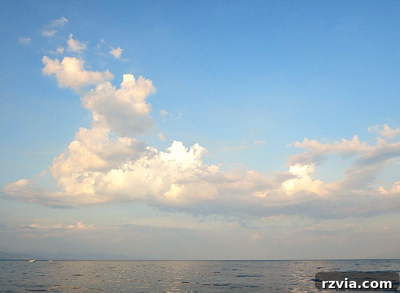 Spectacular cloud formations above the tranquil bay