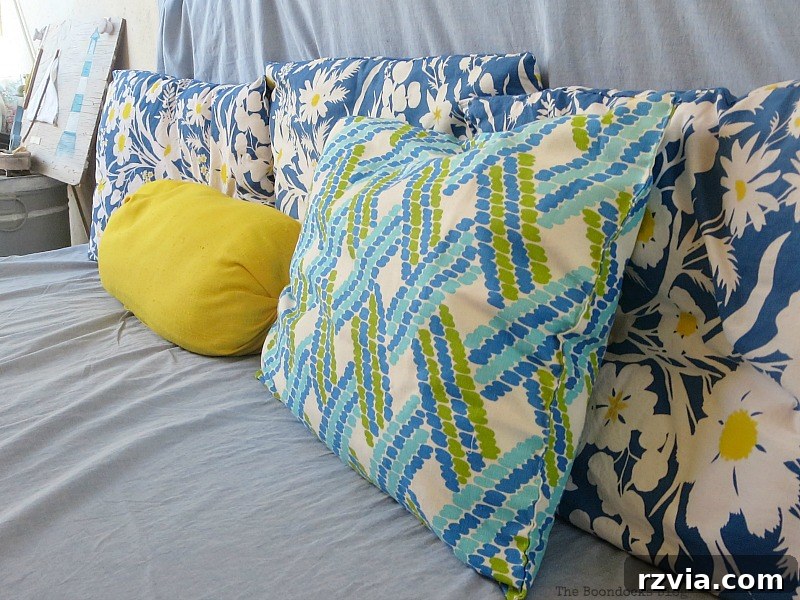 A close-up of an array of colorful pillows and unique wall art, creating a vibrant and artistic ambiance on the balcony. Closeup of Pillows, Part 1 www.theboondocksblog.com