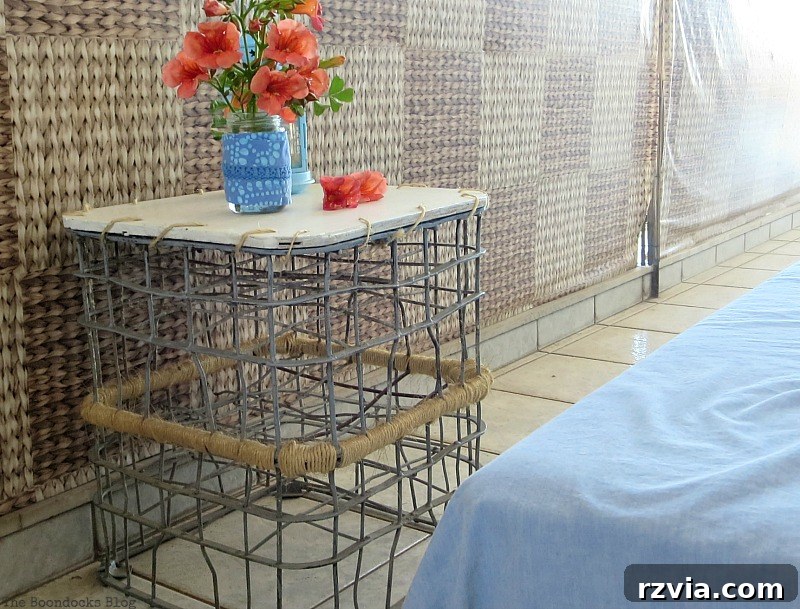 A creative table made from upcycled milk crates, beautifully decorated and ready for summer outdoor enjoyment. A Milk Crates Used as a Table, Part 1 www.theboondocksblog.com