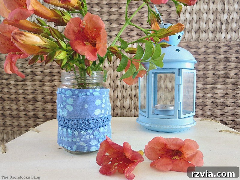 An elegant display featuring a decorative lantern and a delicate flower vase on the table, enhancing the balcony's aesthetic. A Lantern and a Flower Vase, Part 1 www.theboondocksblog.com