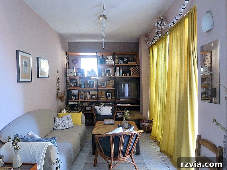 Living Room showing intense glare from glass block window, impacting visibility and comfort.