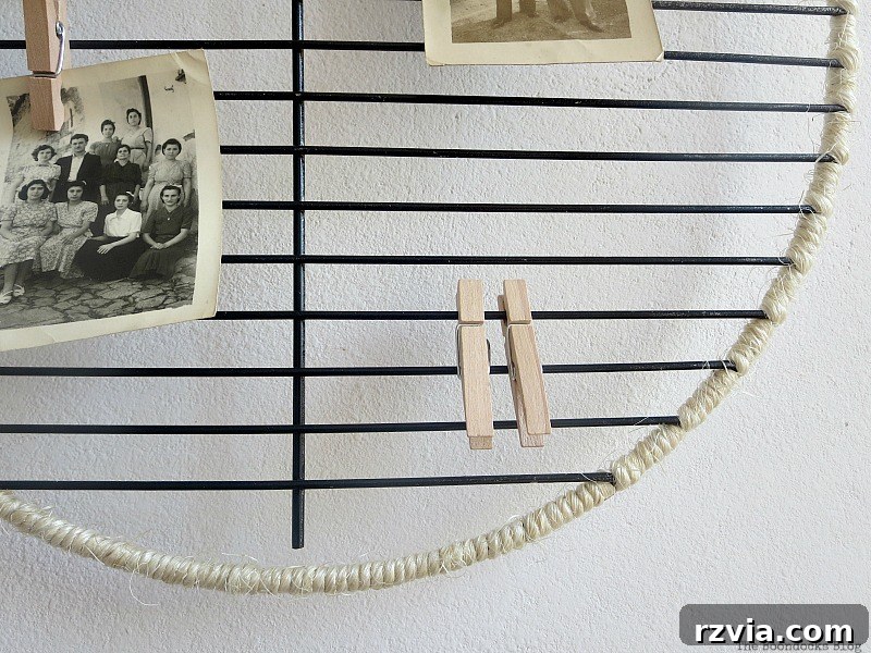 Craft a Heartfelt Photo Display for Dad 9 Detail shot of mini clothespins holding photos on the twine-wrapped photo display