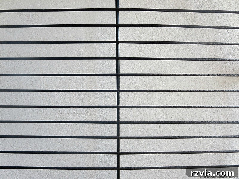 Craft a Heartfelt Photo Display for Dad 3 Spray painting the round metal grill racks black for the DIY photo display