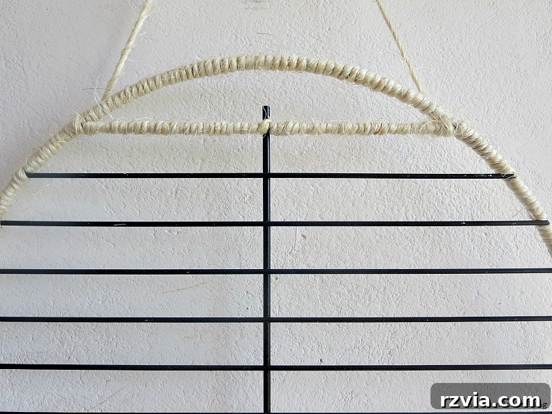 Craft a Heartfelt Photo Display for Dad 4 Hand-wrapping a grill rack with natural twine for a rustic DIY photo frame