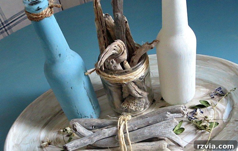 Collection of chalk-painted bottles, used to complement the Greek Beach Table aesthetic in this Int'l Bloggers Club Challenge project by theboodocksblog.com