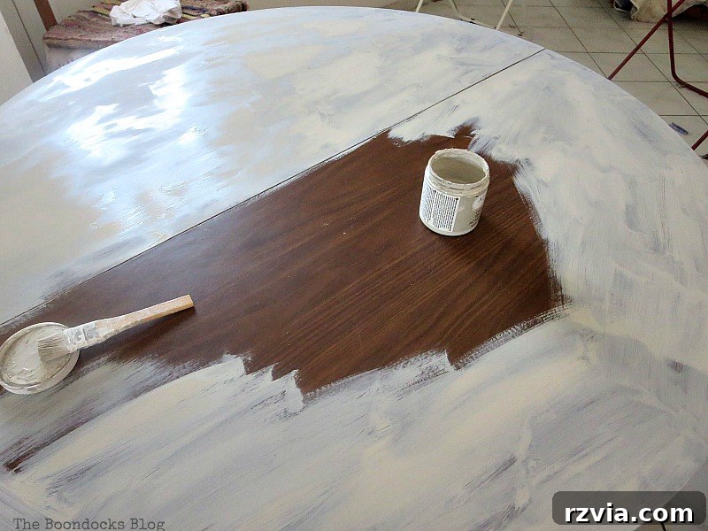 Applying the grey chalk paint primer to the tabletop, preparing it for the iconic Greek blue. Part of the Int'l Bloggers Club Challenge, this step is essential for the Greek Beach Table makeover by theboodocksblog.com