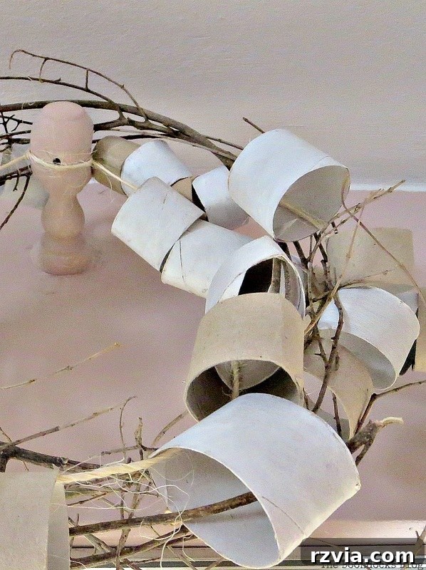 A final close-up of the paper roll garland and wreath installation, presented to the viewer for their assessment and honest opinion on whether this DIY upcycling project is a success or an 'epic fail' in home decor.