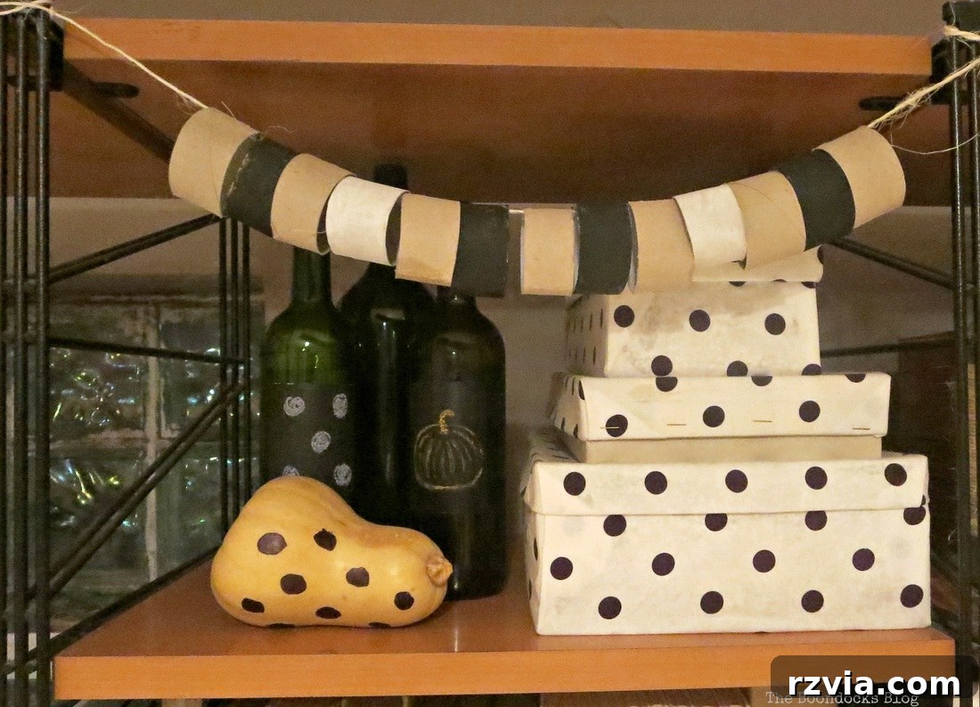 A charming and rustic garland, meticulously crafted from repurposed paper rolls and twine, displayed aesthetically on a wall unit. This previous DIY project served as the inspiration for the current decorative challenge.