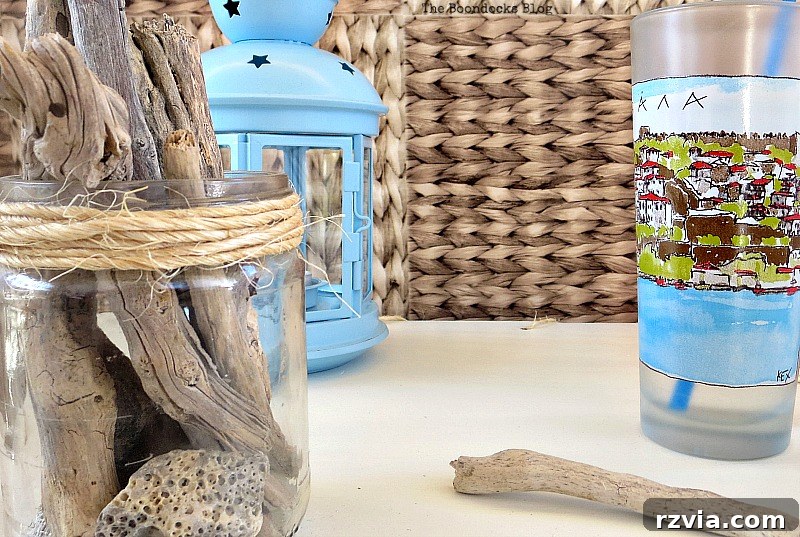 Beyond the Box: Milk Crate Table Reinvention 13 Close up of table top items, including a vibrant blue lantern, a refreshing drinking cup, and natural driftwood artistically arranged in a glass jar, adding aesthetic appeal to the freshly painted surface.