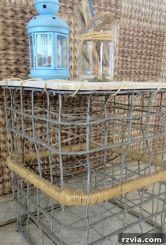 Beyond the Box: Milk Crate Table Reinvention 14 A newly upcycled wire milk crate table positioned outdoors on a balcony, looking fresh and ready for use with a blue lantern on top.