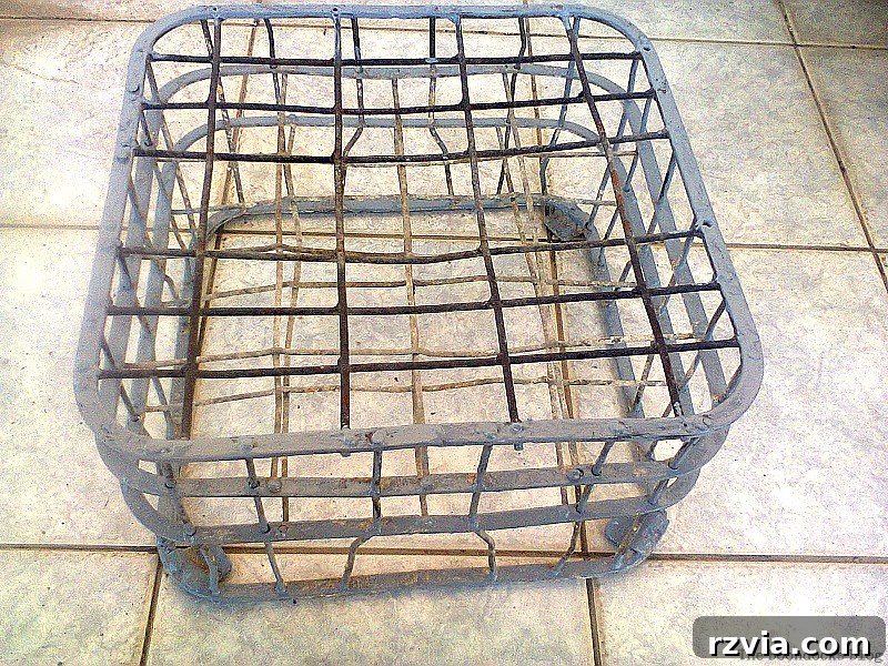 Beyond the Box: Milk Crate Table Reinvention 4 Close-up of a wire milk crate showing significant signs of rust and weathering after being left outdoors.