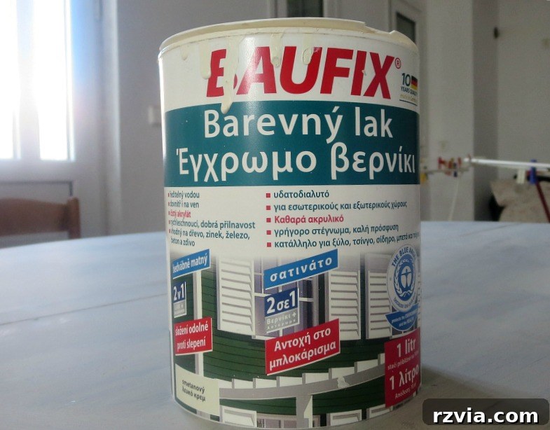 Beyond the Box: Milk Crate Table Reinvention 8 A paint can of white colored varnish with instructions written in Greek, emphasizing the product's origin and specific type, highlighting its dual function.