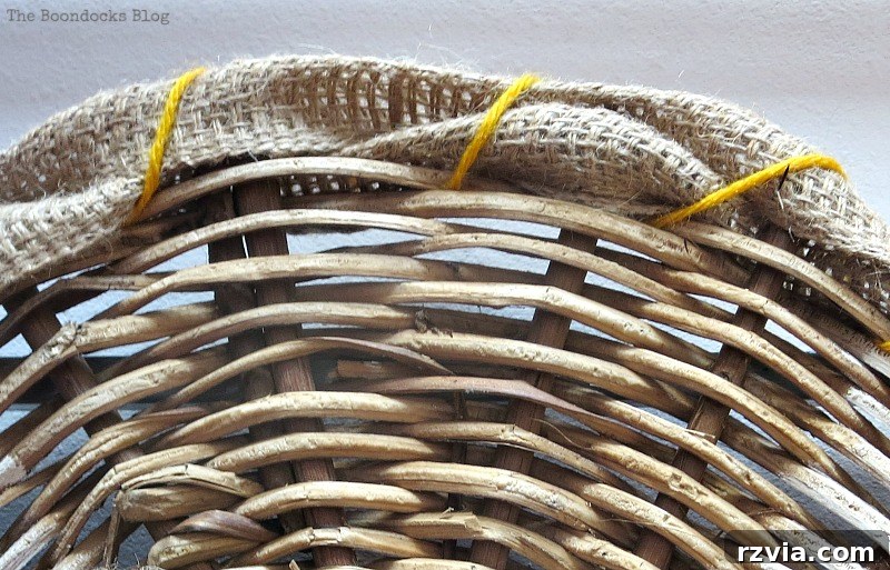 Shabby Chic Wicker Basket Revival 9 Adding yellow yarn to the edges of the wicker and burlap to secure and add color.