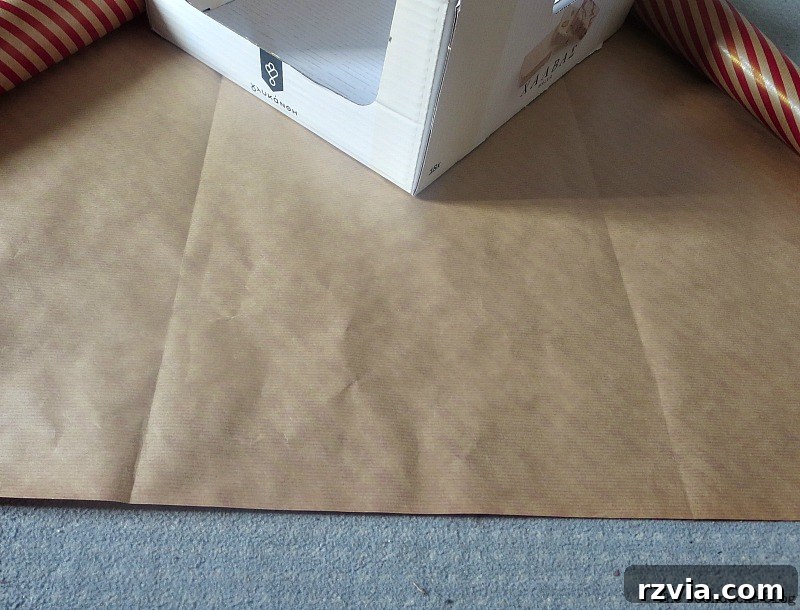 Folding the paper for Pretty Boxes for Organizing Clothes in the Closet www.theboondocksblog.com