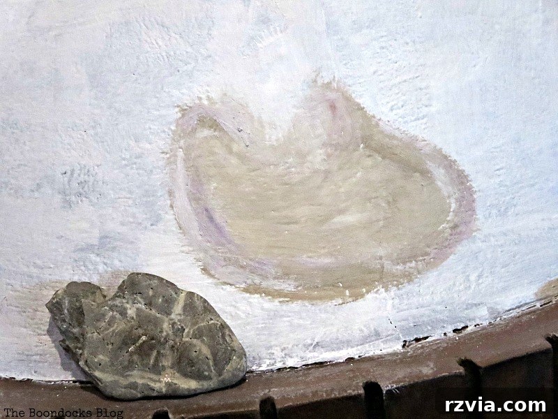 Igniting Style Our Fireplace's Bold Transformation 4 Painting the stones on the fireplace, The Long Overdue Fireplace makeover www.theboondocksblog.com