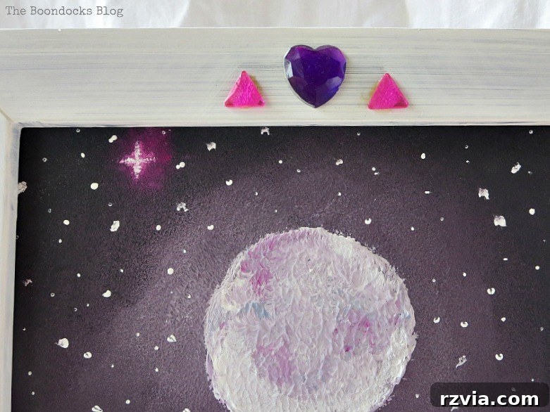 Close-up detail of the decorated picture frame, highlighting the chalk paint finish and glass embellishments for The Stars and Moon project on www.theboondocksblog.com