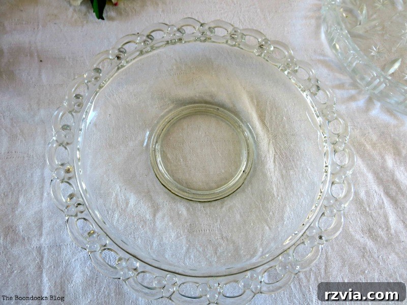 Clear glass dessert plate serving as the stable base for the DIY Easter egg nest