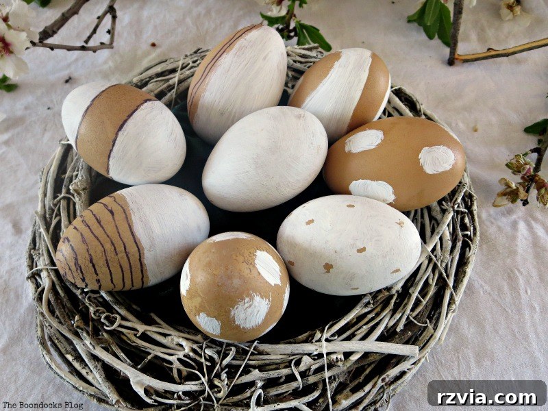 Close-up of natural brown eggs decorated with simple white chalk paint designs and marker accents