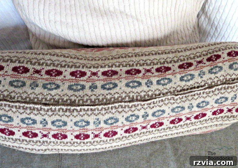 Quick & Cozy: DIY Sweater Pillows 12 Close-up of the securely sewn top of the sweater pillow, demonstrating the complete enclosure of all fabric without waste.