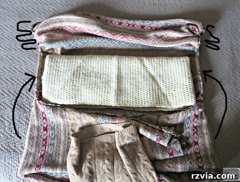 Quick & Cozy: DIY Sweater Pillows 10 The interior of a sweater with gathered ends, showcasing an added scarf for filling and the sweater fabric being folded over it.