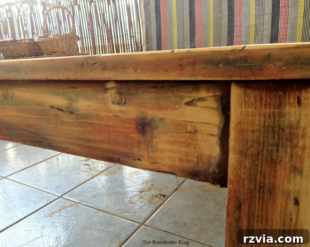 Vibrant Tri-Tone Reclaimed Coffee Table 5 Coffee table top partially sanded, revealing a lighter wood underneath the old stain.