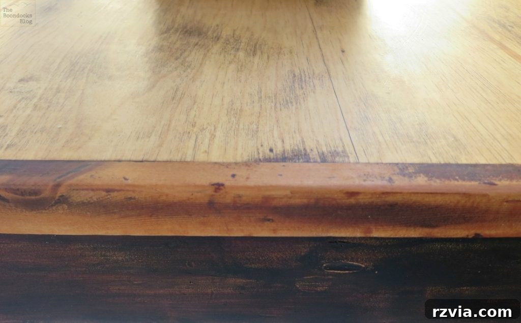 Vibrant Tri-Tone Reclaimed Coffee Table 10 Refurbished coffee table showcasing its three distinct colors: black distressed legs, reddish frame, and blonde wood top.