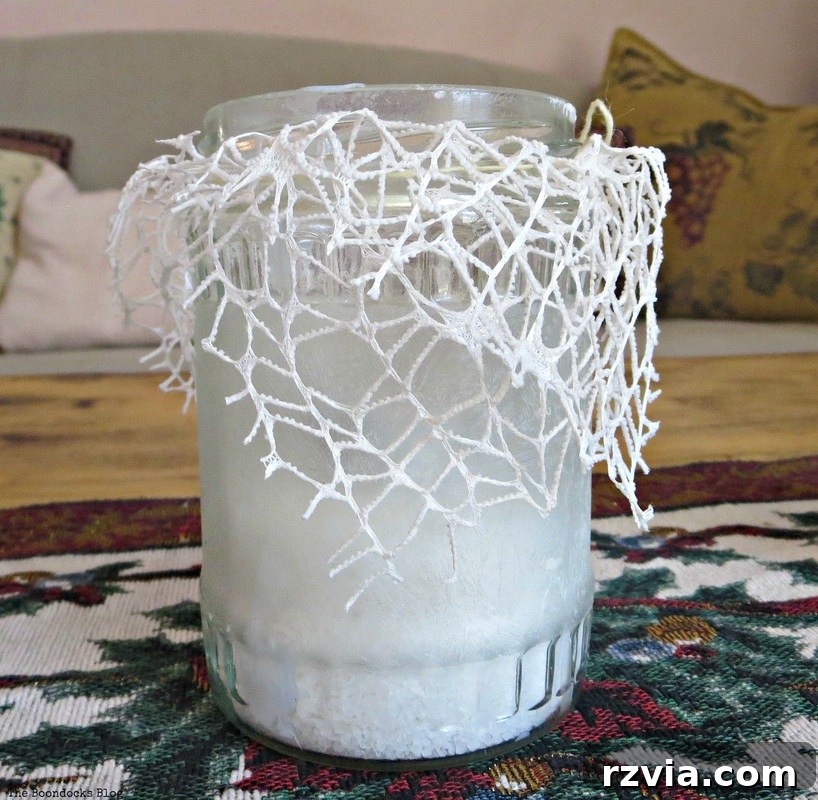 Phantom Snow 5 Frosted jar tealight holder with delicate lace and salt, ready for a candle