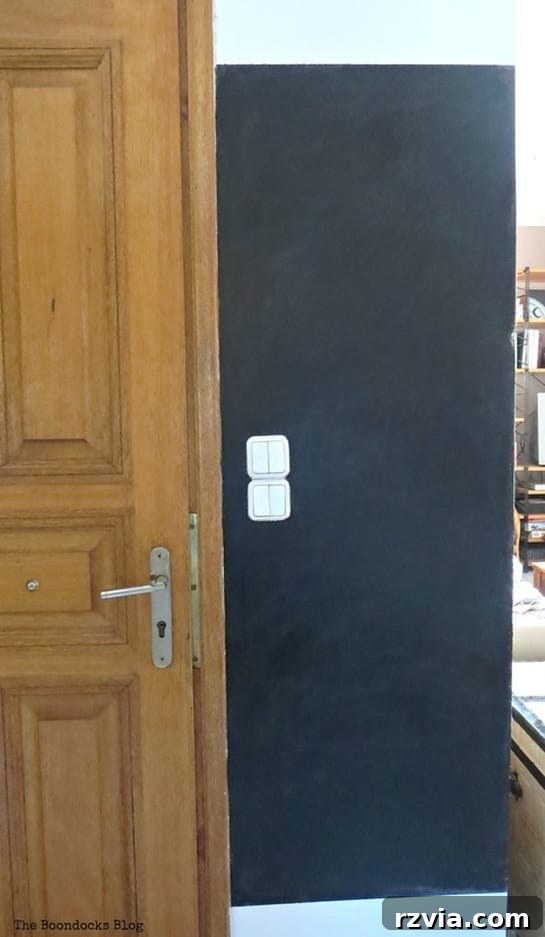 Craft Your Custom Chalkboard Wall 6 Blackboard wall after achieving excellent coverage and smooth finish with four coats of chalkboard paint. www.theboondocksblog.com
