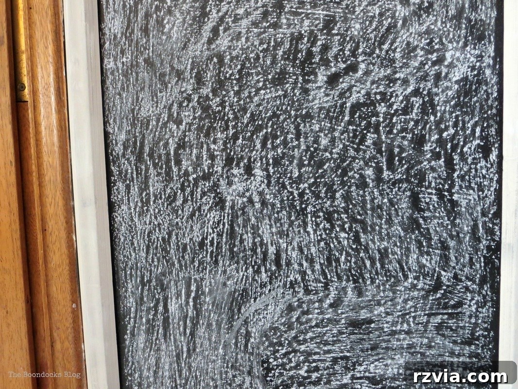Craft Your Custom Chalkboard Wall 10 Close-up of the blackboard wall with its frame, emphasizing the importance of the curing process for durability. www.theboondocksblog.com