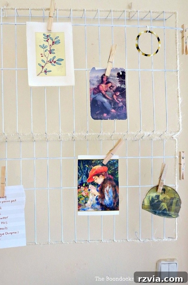 The fully repurposed, twine-wrapped wire rack organizer hung on the wall above a desk, ready for use in a clean workspace. The Twine Lady Returns www.theboondocksblog.com