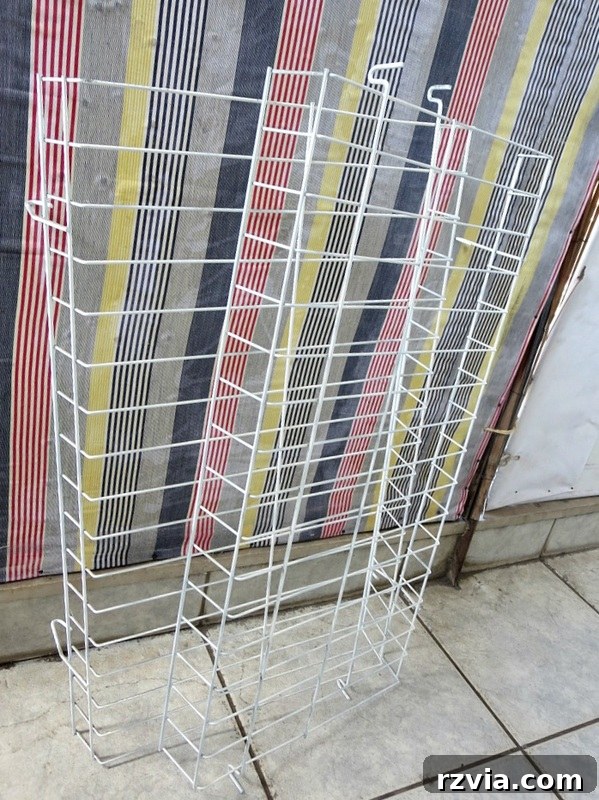 Two wire rack shelves after being spray painted white, ready for the next step in the DIY organizer project. The Twine Lady Returns www.theboondocksblog.com