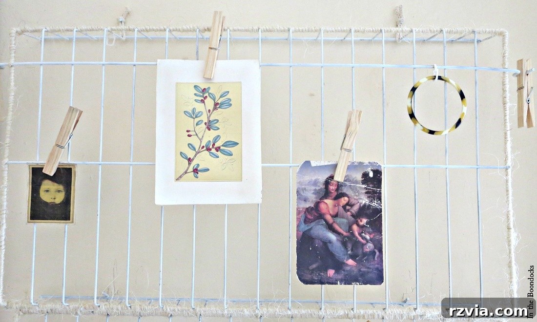 The DIY twine-wrapped wire rack organizer on the wall, filled with inspirational clips and important papers secured by clothespins. The Twine Lady Returns www.theboondocksblog.com