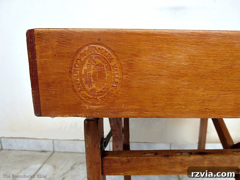The Feature Table 11 Close-up of the vintage stamp on the side of the repurposed wooden cassette holder, adding character.